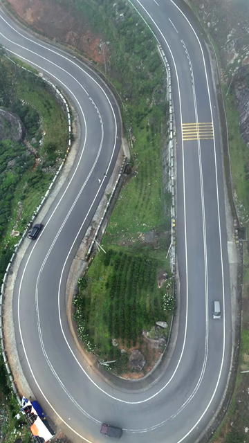 Vertical Aerial View of Scenic Mountain Roads and Tea Plantations in Munnar Kerala India