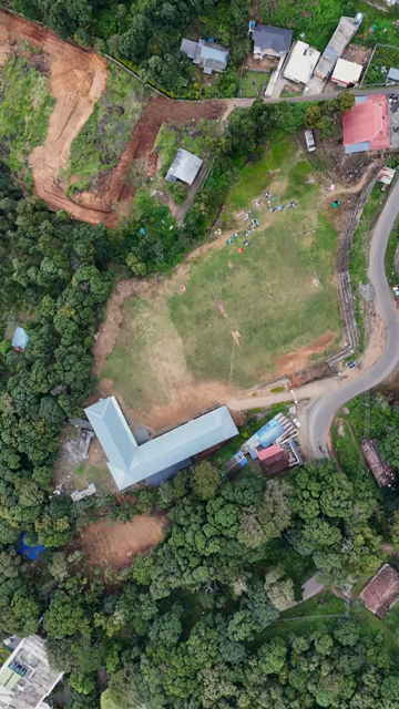 Vertical Aerial View of Scenic Mountain Roads and Tea Plantations in Munnar Kerala India
