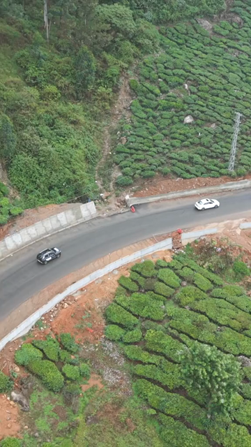 Vertical Aerial View of Scenic Mountain Roads and Tea Plantations in Munnar Kerala India