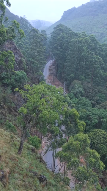Vertical Aerial View of Scenic Mountain Roads and Tea Plantations in Munnar Kerala India