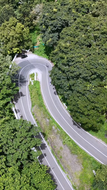Vertical Aerial View of Scenic Mountain Roads and Tea Plantations in Munnar Kerala India