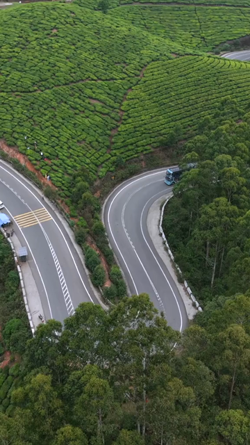 Vertical Aerial View of Scenic Mountain Roads and Tea Plantations in Munnar Kerala India