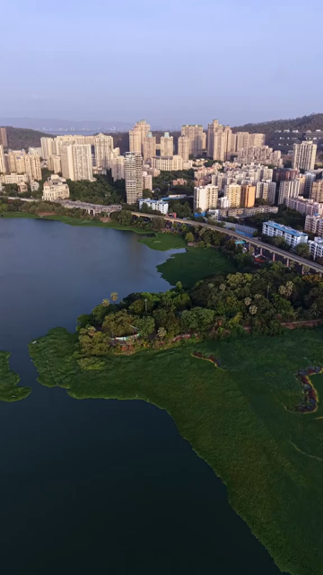 Vertical Aerial View of Powai Lake and Mumbai Skyline India