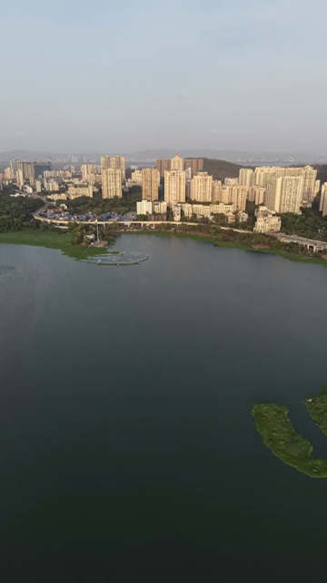 Vertical Aerial View of Powai Lake and Mumbai Skyline India