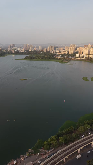 Vertical Aerial View of Powai Lake and Mumbai Skyline India