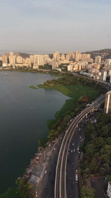 Vertical Aerial View of Powai Lake and Mumbai Skyline India