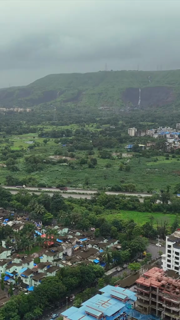 Vertical Aerial View of Pune City with Green Hills and Monsoon Landscape Maharashtra