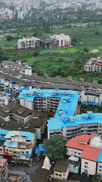 Vertical Aerial View of Pune City with Green Hills and Monsoon Landscape Maharashtra
