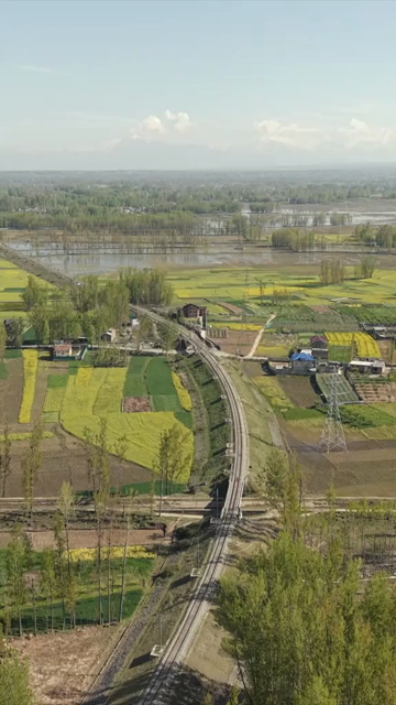 Vertical Aerial View of Railway Track Through Farmland in Pampore Kashmir India