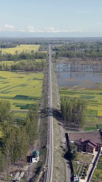 Vertical Aerial View of Railway Track Through Farmland in Pampore Kashmir India