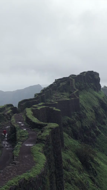 Vertical Aerial View of Rajgad Fort and Lush Sahyadri Mountains Maharashtra