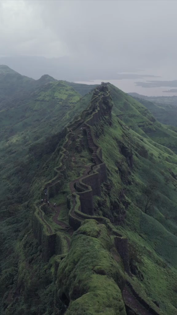 Vertical Aerial View of Rajgad Fort and Lush Sahyadri Mountains Maharashtra