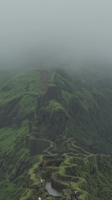 Vertical Aerial View of Rajgad Fort and Lush Sahyadri Mountains Maharashtra