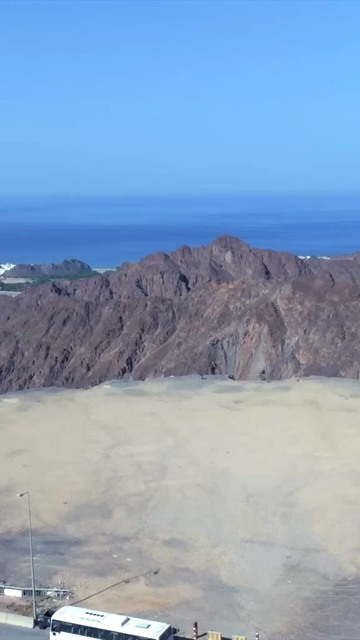 Vertical Aerial View of Rugged Mountains and Gulf of Oman Coastline Muscat Oman