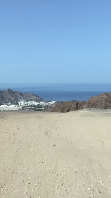 Vertical Aerial View of Rugged Mountains and Gulf of Oman Coastline Muscat Oman
