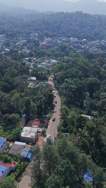 Vertical Aerial View of Scenic Mountain Roads and Tea Plantations in Munnar Kerala India