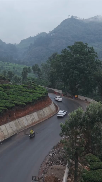 Vertical Aerial View of Scenic Mountain Roads and Tea Plantations in Munnar Kerala India