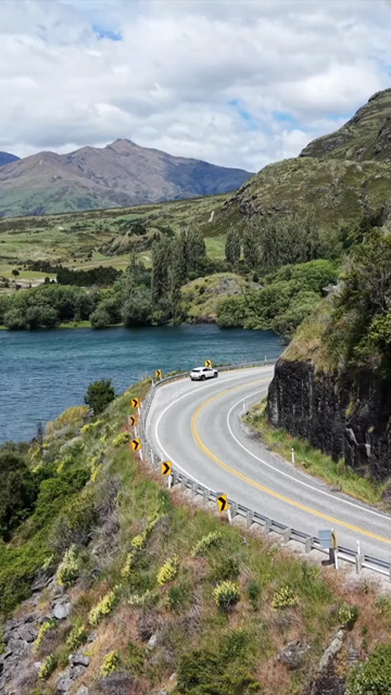 Vertical Aerial View of Scenic Road Along Lake Wanaka in New Zealand