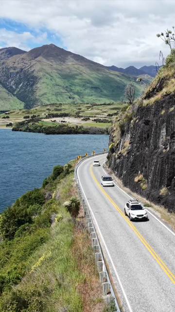 Vertical Aerial View of Scenic Road Along Lake Wanaka in New Zealand
