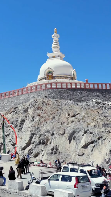 Vertical Aerial View of Shanti Stupa with Himalayan Mountains in Leh Ladakh India