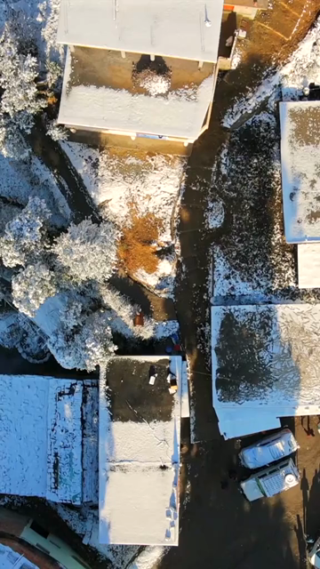 Vertical Aerial View of Snow Covered Village Near Brahmatal Uttarakhand India