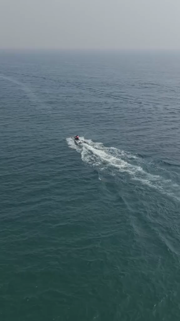 Vertical Aerial View of Speedboat at Vizag Beach India