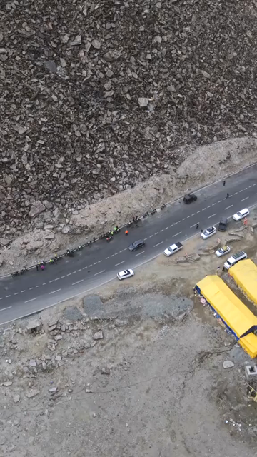 Vertical Aerial View of Tourist Bikers Riding Through Ladakh, India
