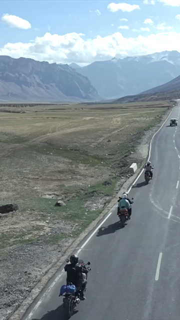 Vertical Aerial View of Tourist Bikers Riding Through Ladakh, India