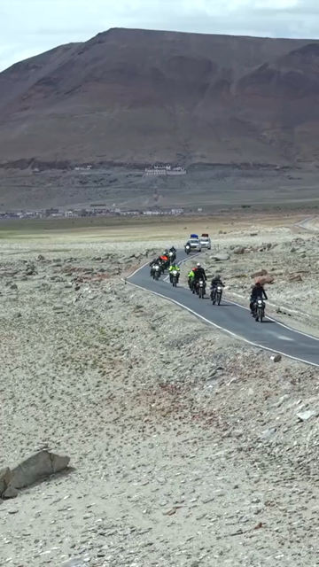 Vertical Aerial View of Tourist Bikers Riding Through Ladakh, India
