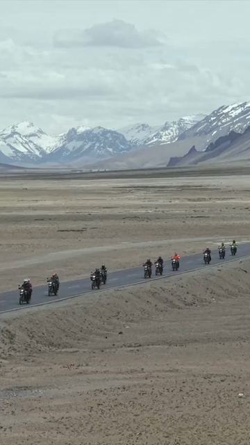 Vertical Aerial View of Tourist Bikers Riding Through Ladakh, India