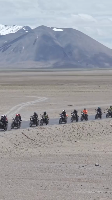 Vertical Aerial View of Tourist Bikers Riding Through Ladakh, India