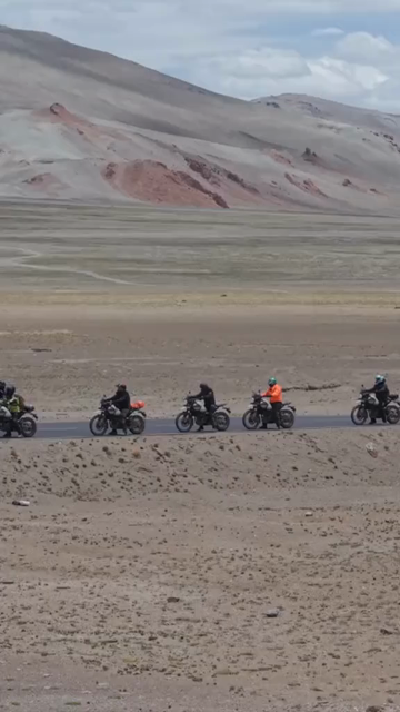 Vertical Aerial View of Tourist Bikers Riding Through Ladakh, India