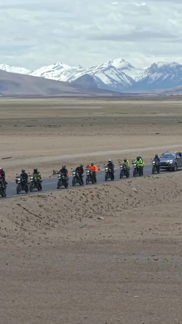 Vertical Aerial View of Tourist Bikers Riding Through Ladakh, India