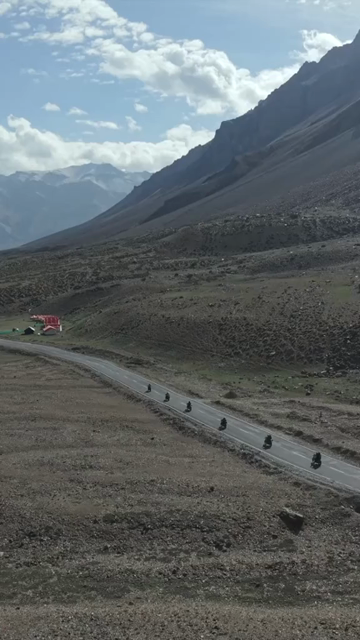 Vertical Aerial View of Tourist Bikers Riding Through Ladakh, India
