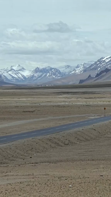 Vertical Aerial View of Tourist Bikers Riding Through Ladakh, India