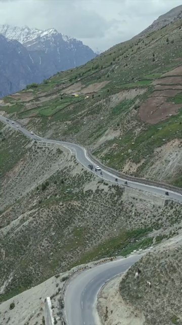 Vertical Aerial View of Tourist Bikers Riding Through Ladakh, India