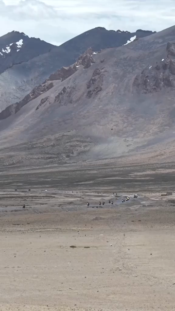 Vertical Aerial View of Tourist Bikers Riding Through Ladakh, India