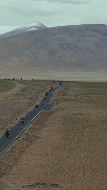 Vertical Aerial View of Tourist Bikers Riding Through Ladakh, India
