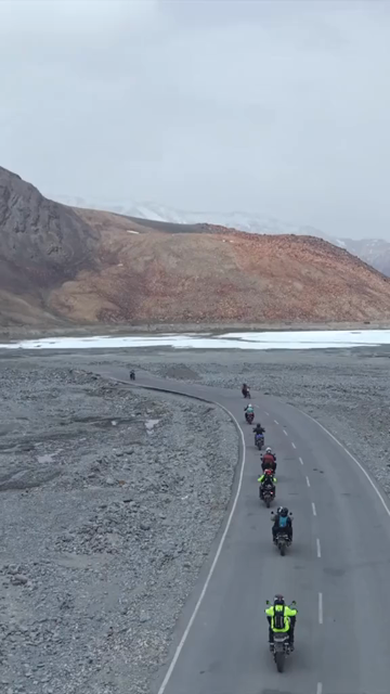 Vertical Aerial View of Tourist Bikers Riding Through Ladakh, India