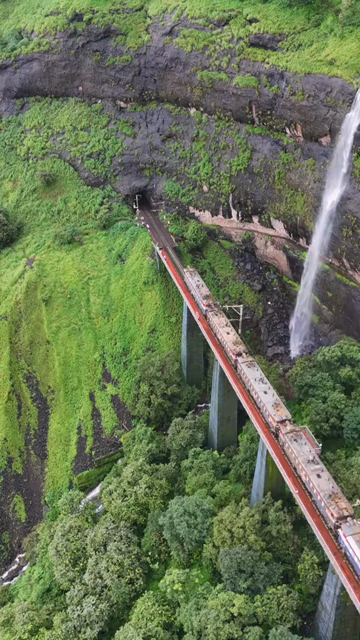Vertical Aerial View of Train Entering Tunnel in Maharashtra