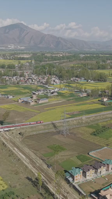 Vertical Aerial View of Train Passing Through Pampore Kashmir Valley India