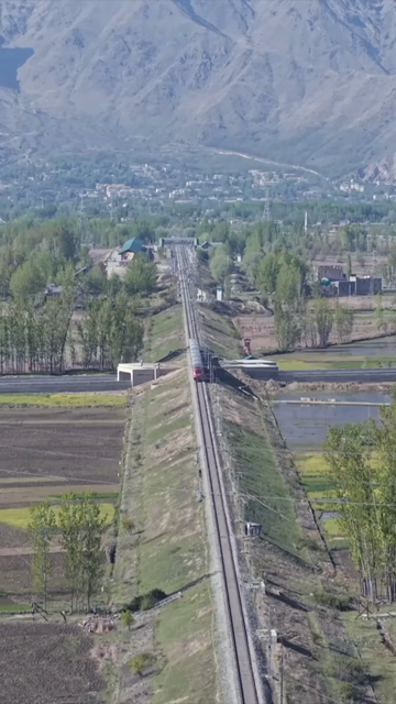 Vertical Aerial View of Train Passing Through Pampore Kashmir Valley India
