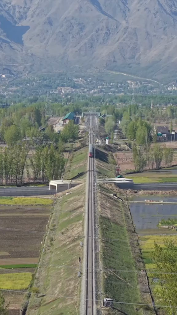 Vertical Aerial View of Train Passing Through Pampore Kashmir Valley India