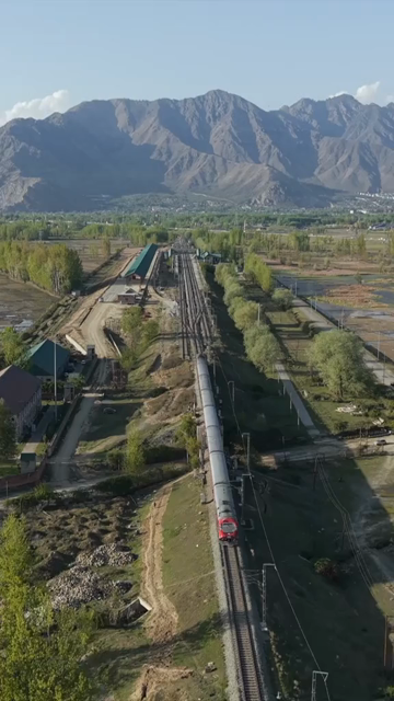 Vertical Aerial View of Train Passing Through Pampore Kashmir Valley India