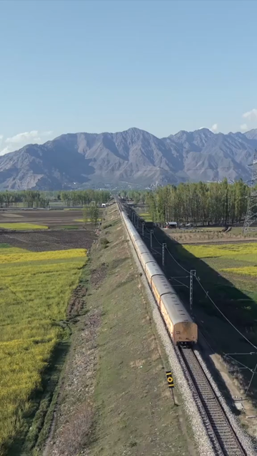 Vertical Aerial View of Train Passing Through Pampore Kashmir Valley India
