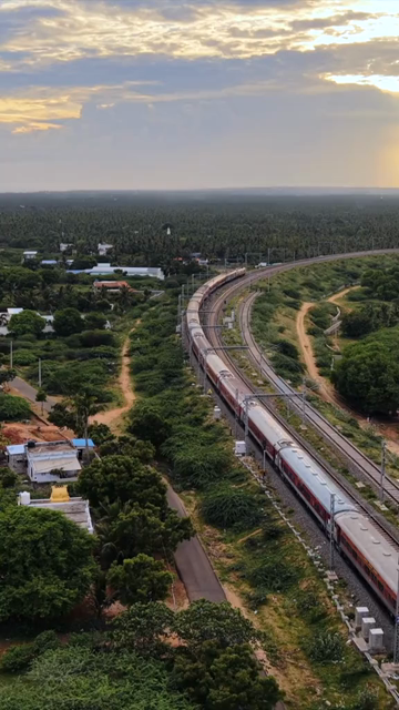 Vertical Aerial View of Train and Coastal Landscape with Mountains in Kanyakumari Tamil Nadu