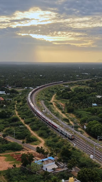 Vertical Aerial View of Train and Coastal Landscape with Mountains in Kanyakumari Tamil Nadu