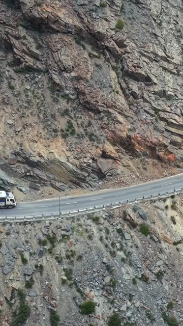 Vertical Aerial View of Vehicle on Mountain Road in Ladakh, India