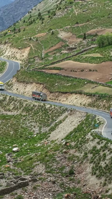 Vertical Aerial View of Vehicle on Mountain Road in Ladakh, India
