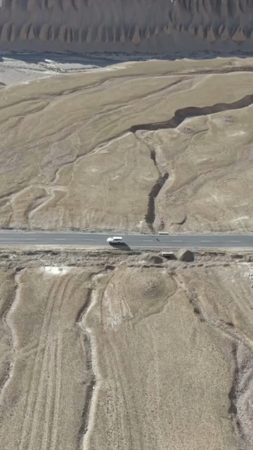 Vertical Aerial View of Vehicle on Mountain Road in Ladakh, India